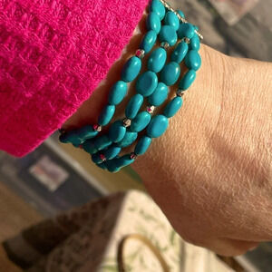 Turquoise colored glass stretch bracelet,wrist under 7” silver/rhinestone accent
